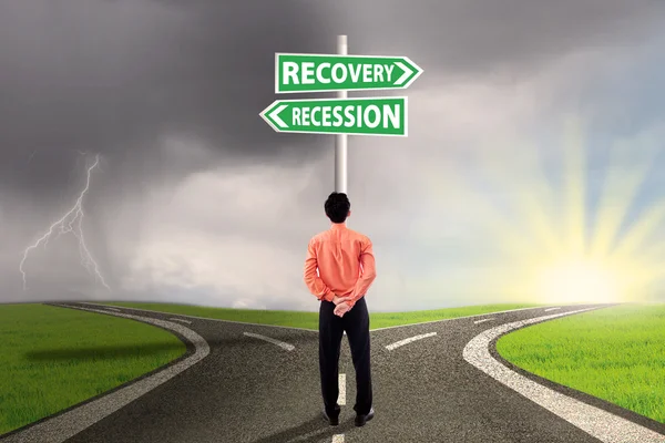 Worker choose the recession or recovery finance — Stock Photo, Image