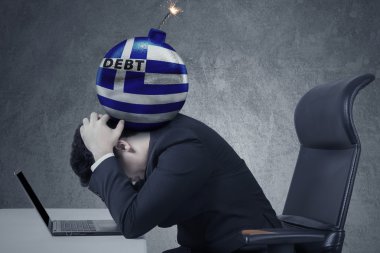 Bomb of debt with a Greece flag on the man head