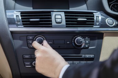 Hand adjusting the car button