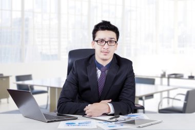 Handsome manager sitting in the office