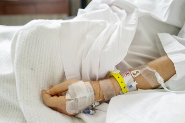 Patient hand with infusion in the hospital