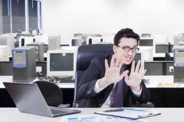 Scared worker working in the office