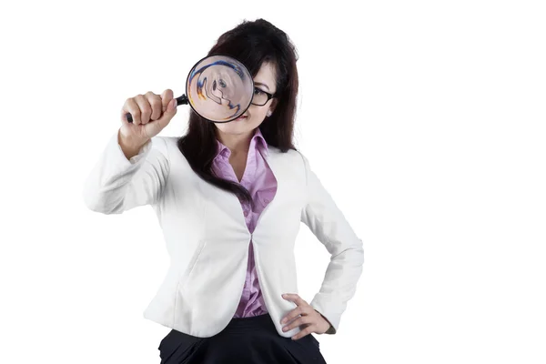 Female manager using a magnifier — Stockfoto