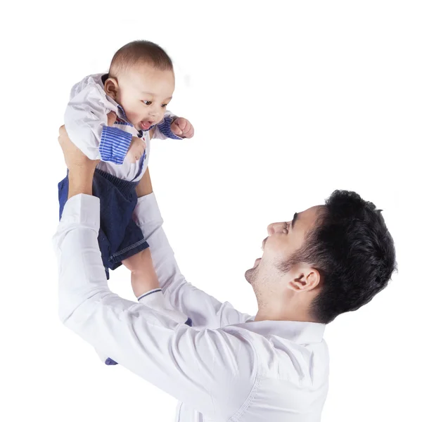 Happy dad holds and lift up his baby — Stock Photo, Image