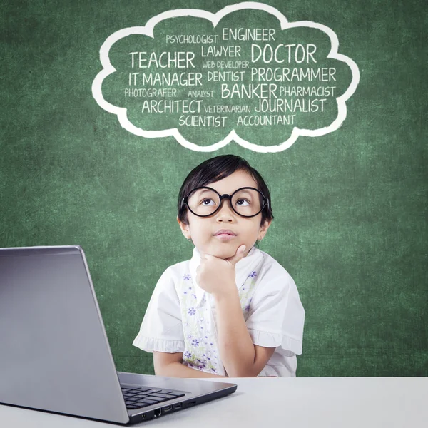 Pensive student with laptop imagine her ideals — Stockfoto