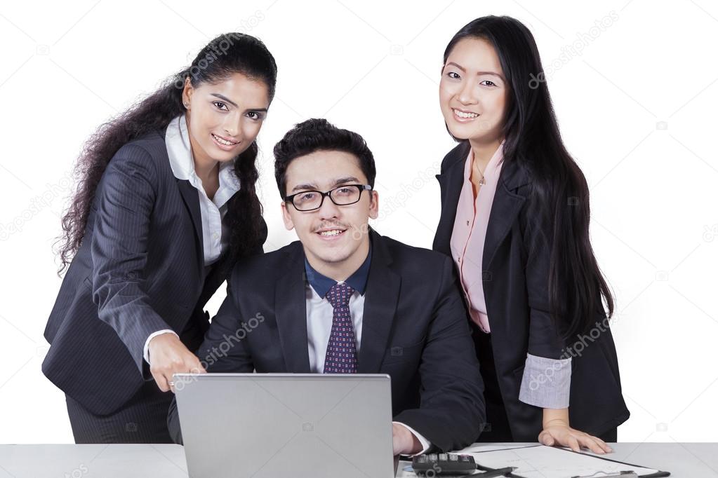 Three corporate workers with laptop isolated