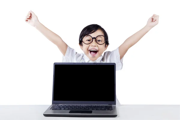 Lovely girl with laptop celebrate her victory — Stockfoto