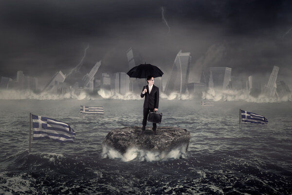 Man on the sea with the city and Greek flag sinking