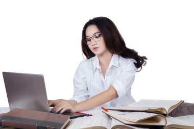 Pretty girl with black hair doing homework