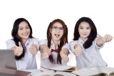 Joyful students showing hands gesture