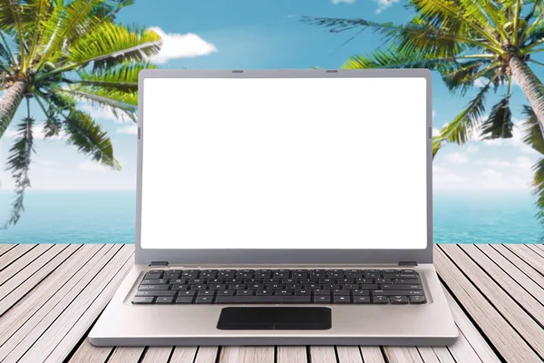 Laptop with empty screen on the wooden pier — Stok fotoğraf