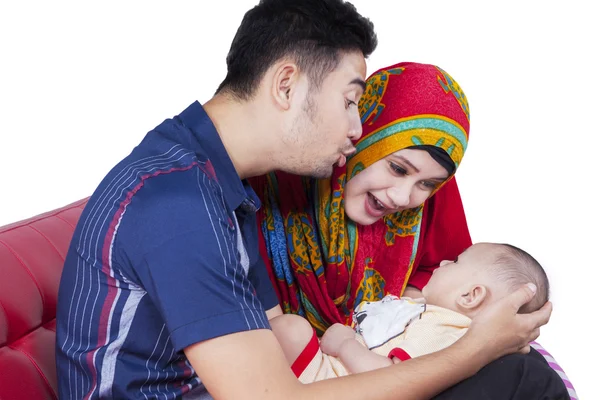 Muslim couple playing with cute baby — Stok fotoğraf
