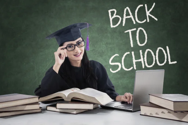 Clever learner with mortarboard back to school — Stock Photo, Image