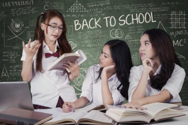 Girls back to school and studying togehter