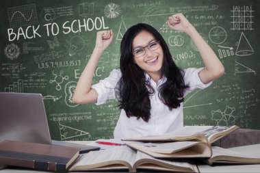 Happy student celebrate back to school in class