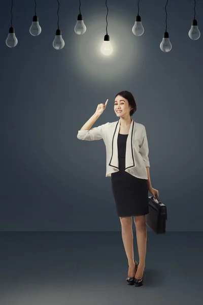 Creative businesswoman pointing lightbulb 2 — Φωτογραφία Αρχείου