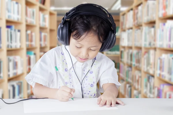 Smart primary school student with headphones