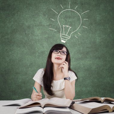 Creative learner studying and thinks idea in class