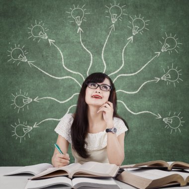 Female learner and branchy light bulb