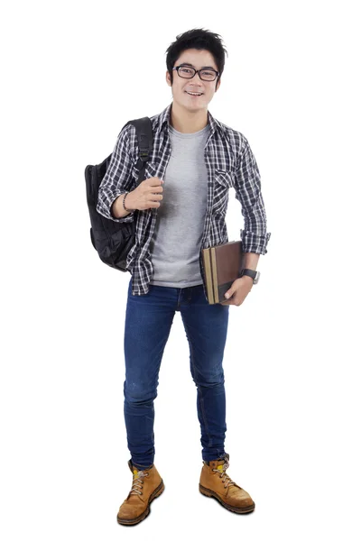 Clever male student standing in the studio — Stockfoto