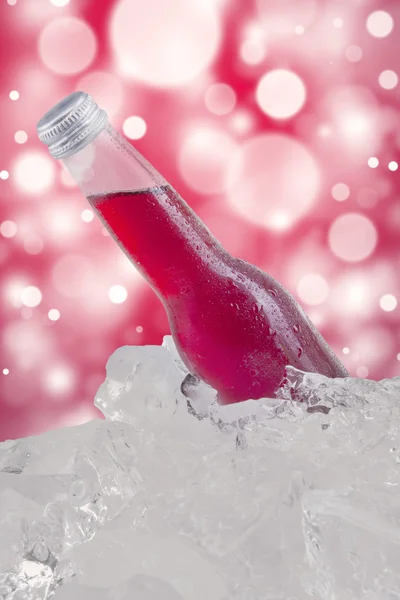 Cold lager with ice cube and bokeh background — Stock Photo, Image