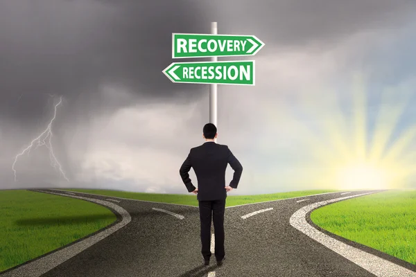 Man with two choices of recession or recovery — Stock Photo, Image