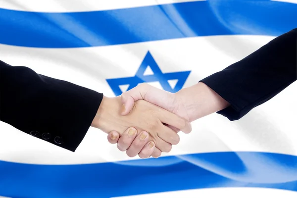 Aperto de mão com fundo bandeira israel — Fotografia de Stock