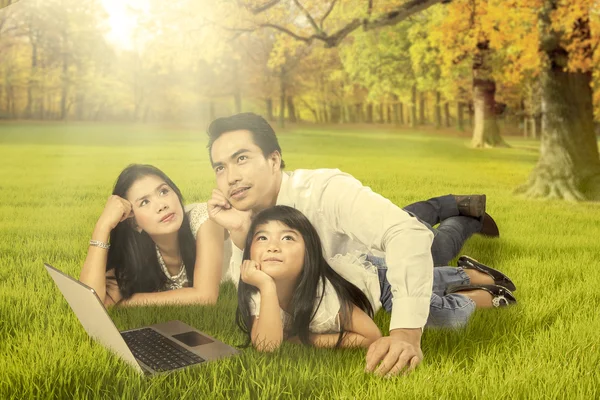 Thoughtful family daydreaming in the nature — Stock Photo, Image