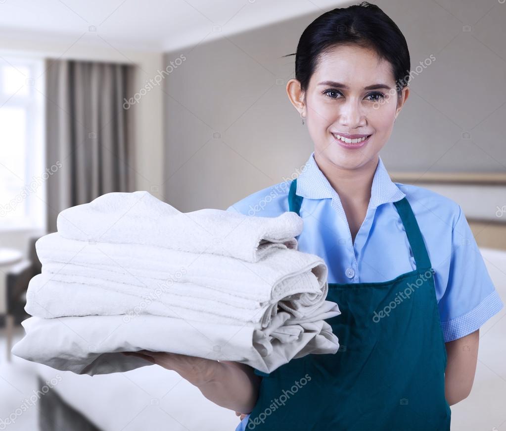 Maid is holding towels