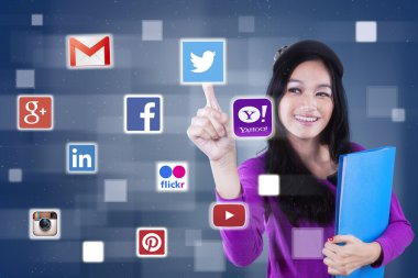 Girl using social media sites on the futuristic screen clipart
