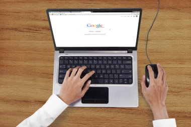 Hands opens google search web page