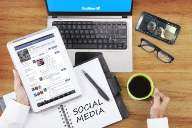 Person opens social media site with gadget