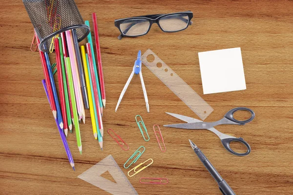 Stationery objects on the wooden background — Stock Photo, Image