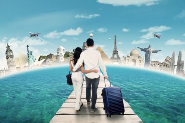 Couple going to honeymoon on the famous monuments clipart
