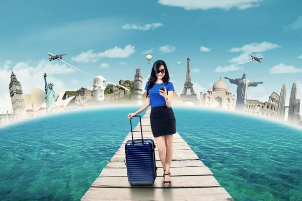 Female tourist texting on the bridge — Stock Photo, Image