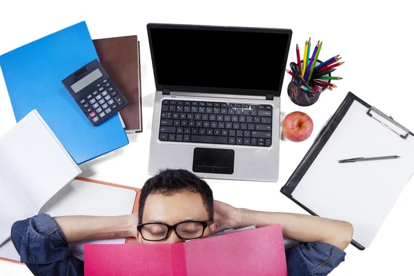 Male student sleeping on the floor after studying — Stock Photo, Image