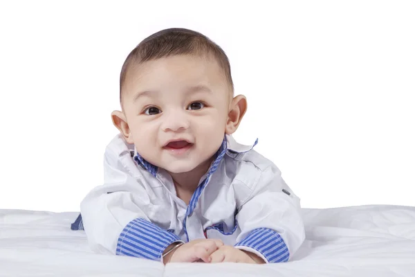 Attractive male infant laughing on bed — Stock Fotó