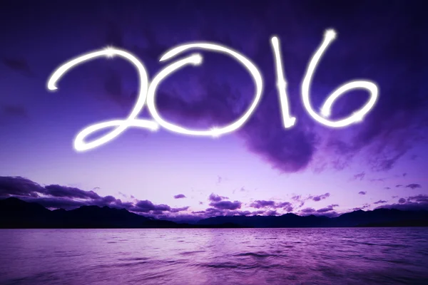 Feliz año nuevo con números brillantes 2016 en la playa — Foto de Stock