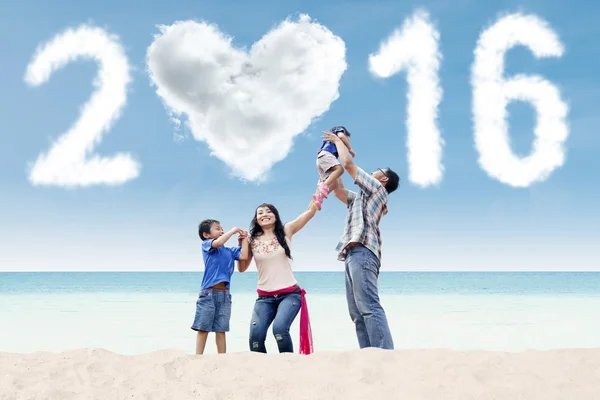 Playful asian family celebrate new year of 2016 — Stock Photo, Image