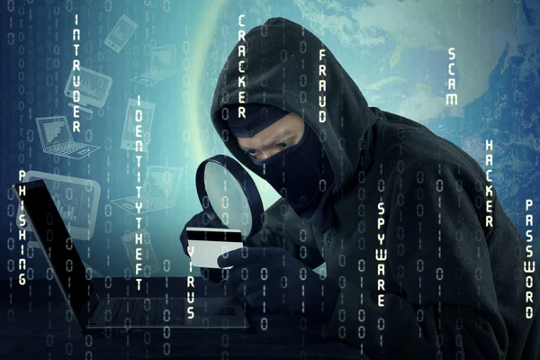 Hacker looking the credit card number — Stock Photo, Image