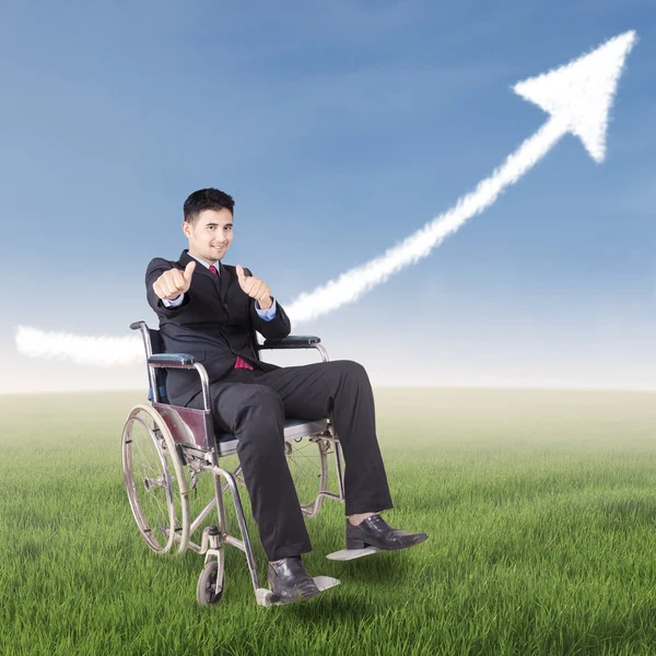 Successful disabled businessman with upward arrow — Stock Photo, Image