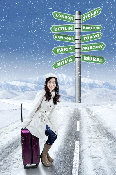 Woman and destinations for winter holiday — Stock Photo, Image