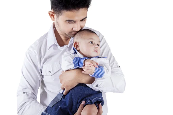 Young man and his baby in studio — Stock Photo, Image