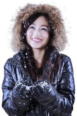 Happy woman catching snow