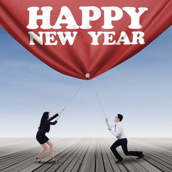 Businesspeople with new year text — Stock Photo, Image