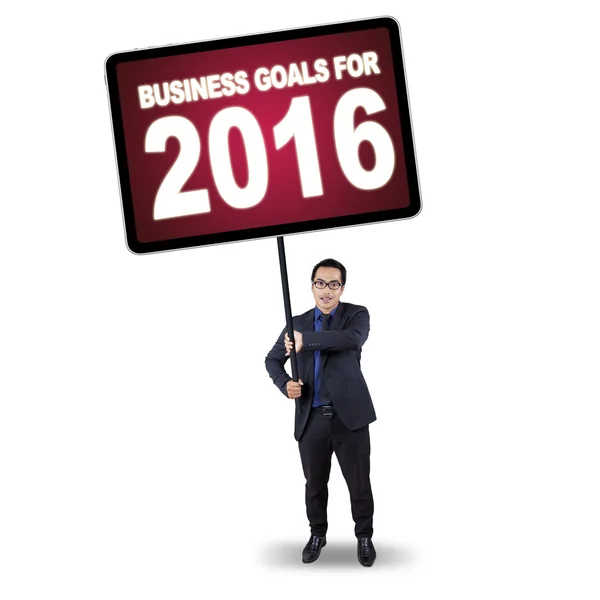 Man holds billboard with business goals for 2016 — Stock Photo, Image