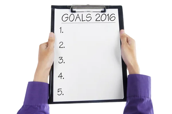 Hands holding clipboard to make business goals in 2016 — Stock Photo, Image