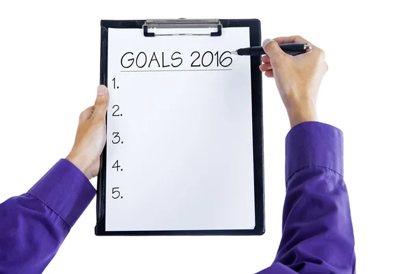 Mani tenere appunti per scrivere obiettivi di business nel 2016 — Foto Stock