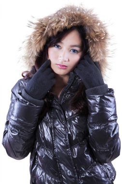 Teenage girl wearing fur jacket