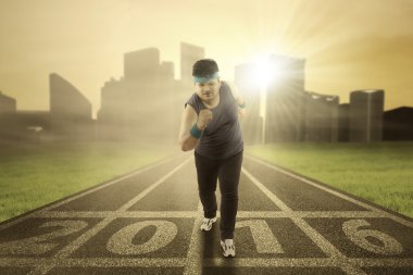 Overweight person workout on the field